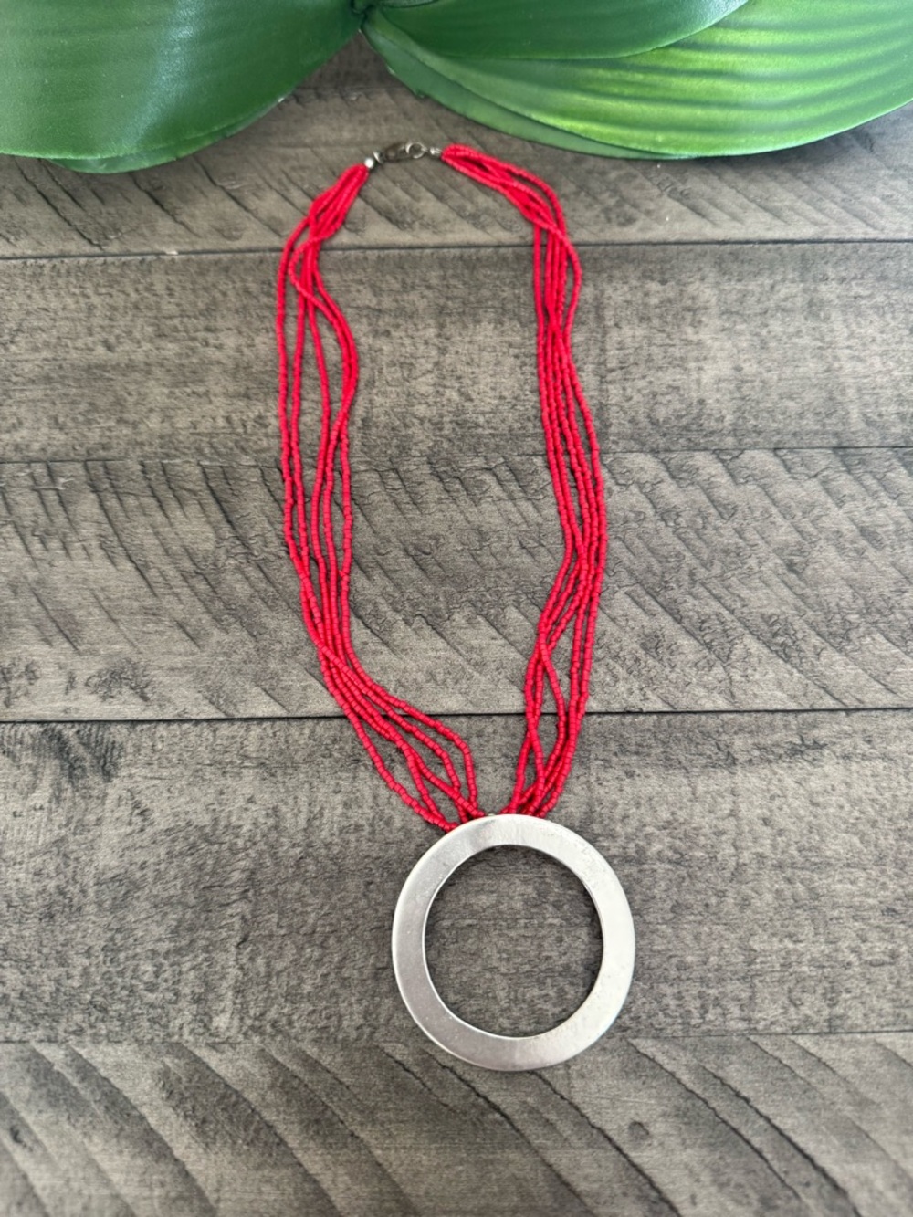 Red Multi-Strand Beaded Necklace with Silver Circle Pendant